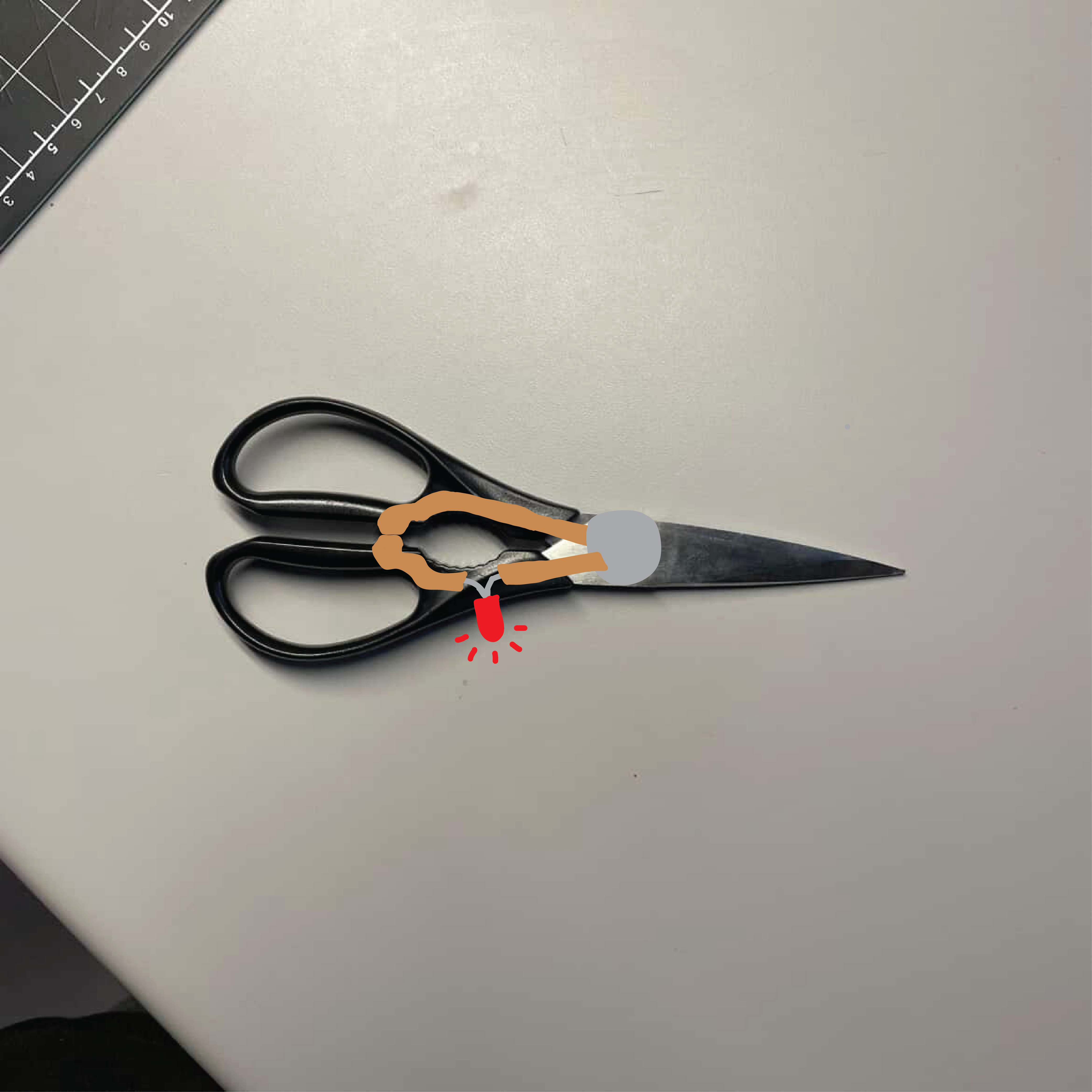 When the scissors close, the copper tape touches and activiates the LED light connected to it.