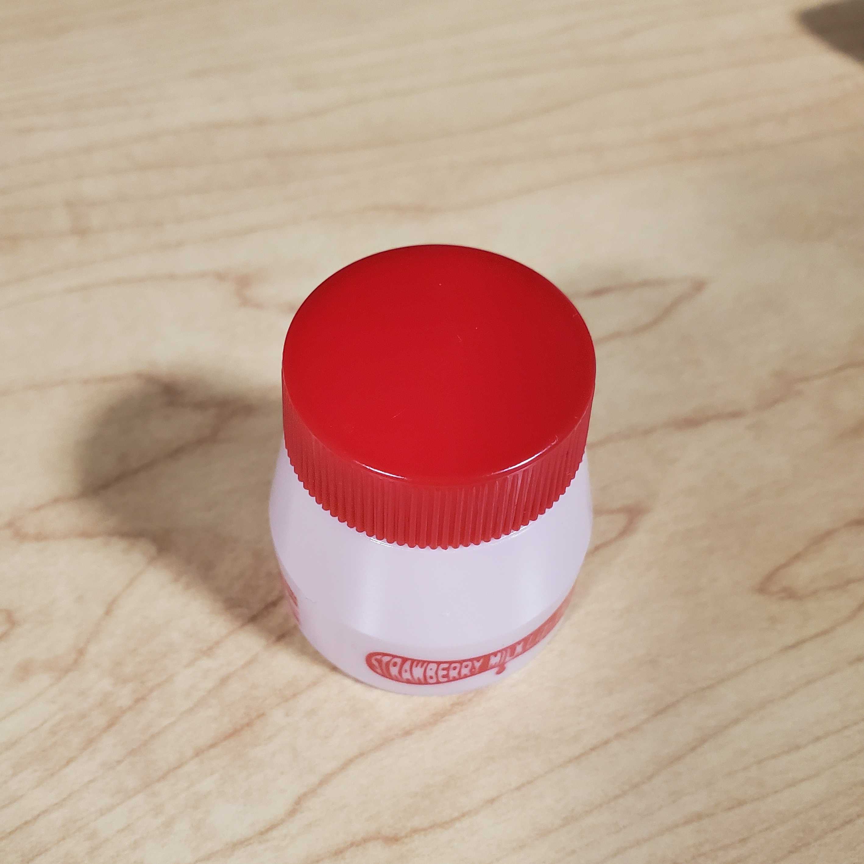 Image of lip balm from a upper-facing angle