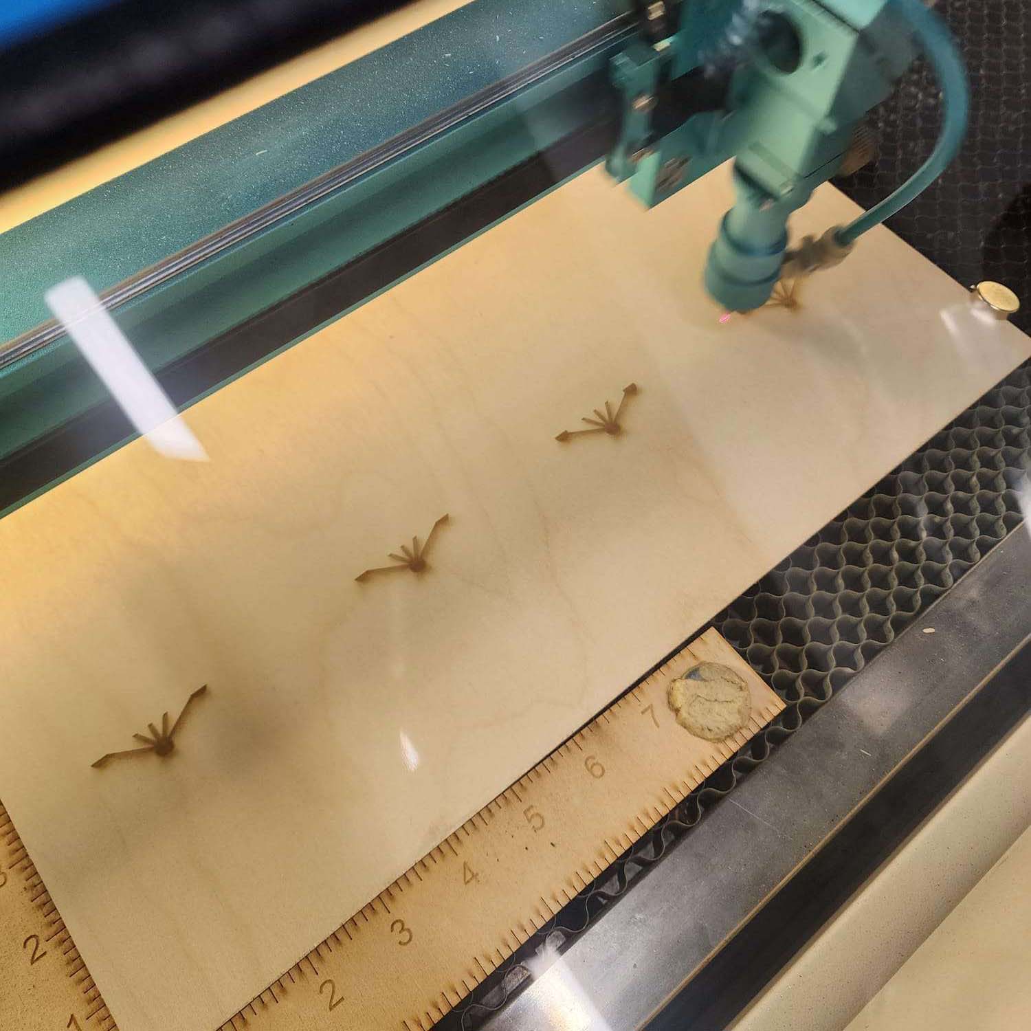 This is the process of the design being marked onto the wood that our group purchased from the book store