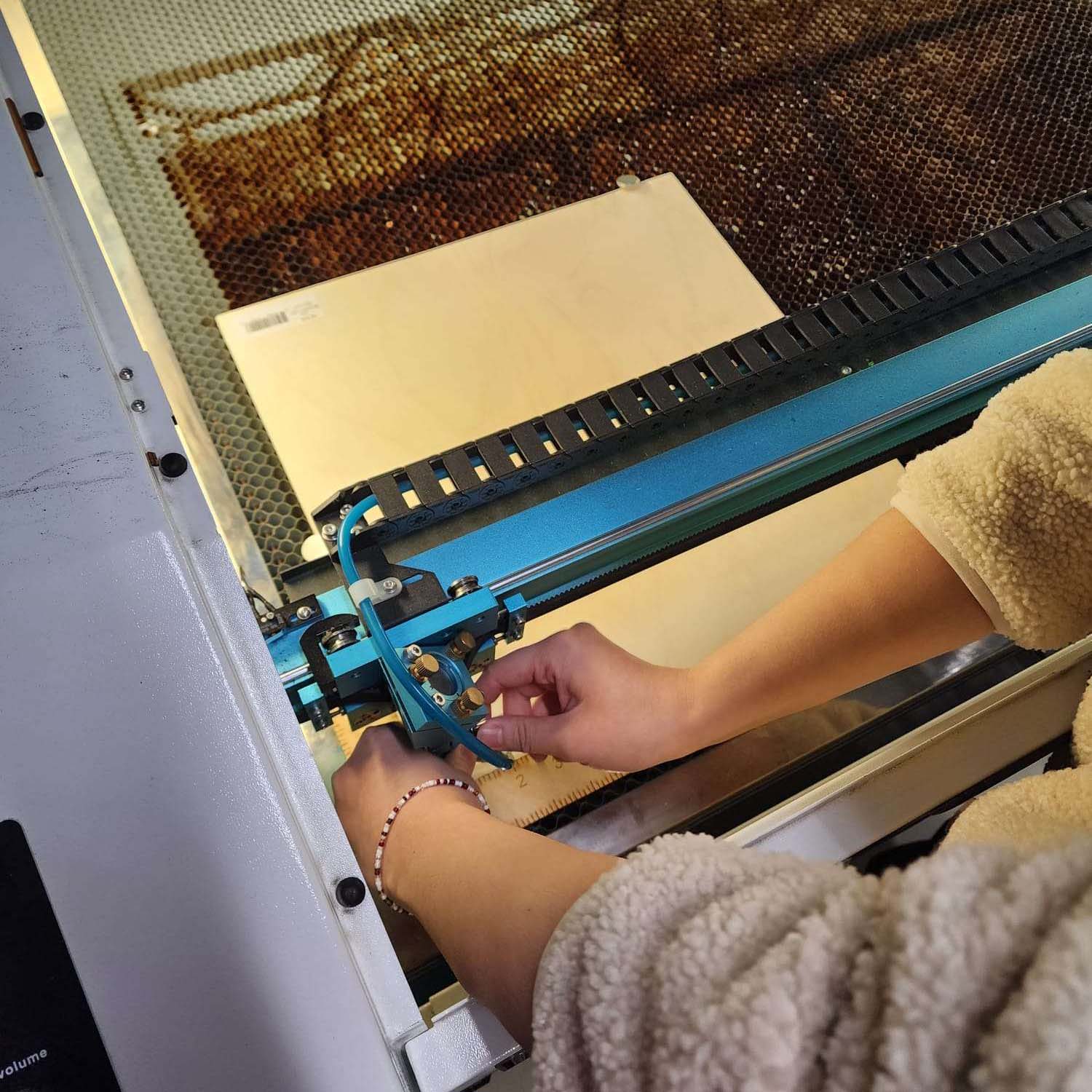 This is the wooden board being leveled in preparation for laser cutting 