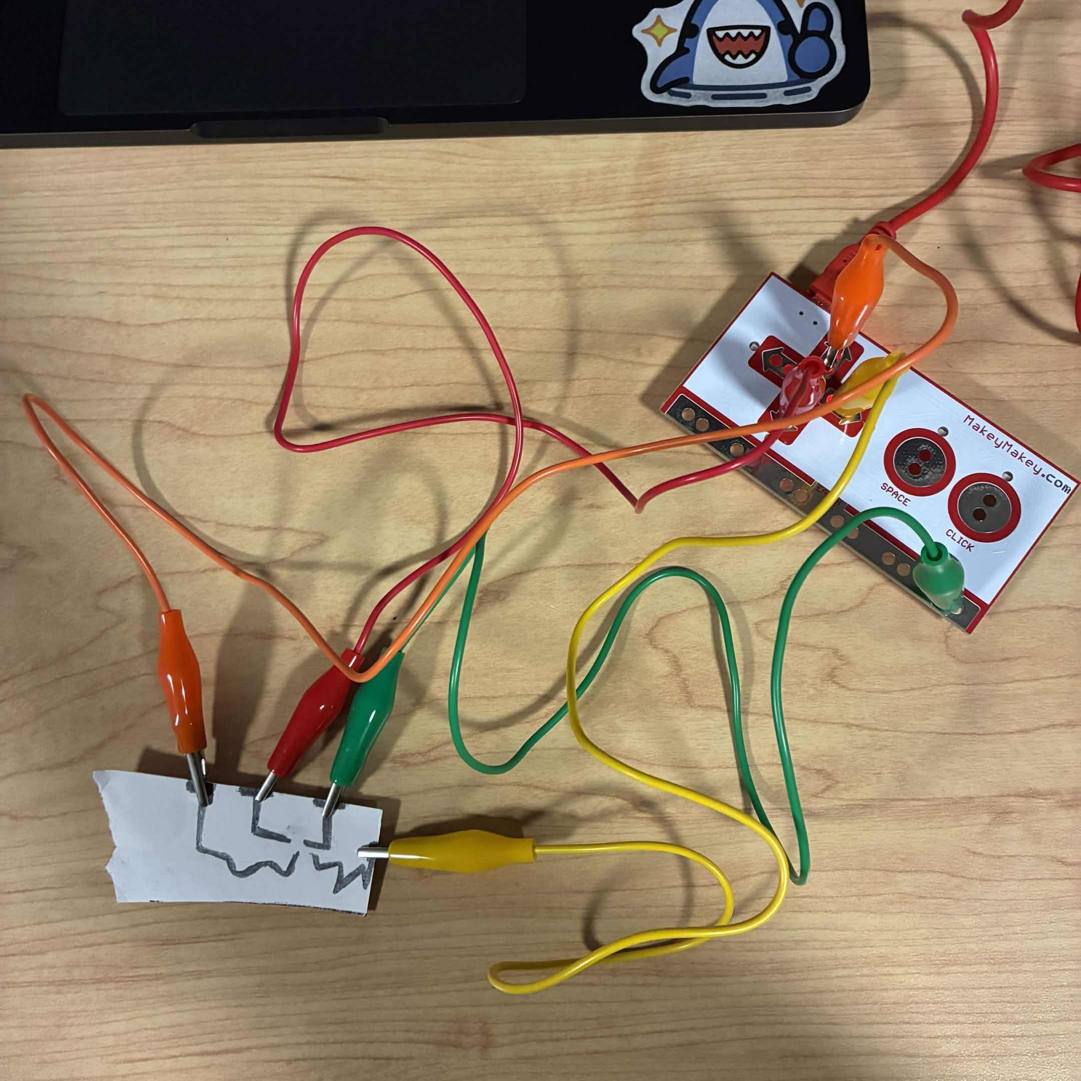 I drew more circuits with a funkier shape. The green wire is connected to the ground and the red wire is connected to the down button, the orange wire is connected to the up button, and the yellow wire is connected to the right button.